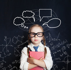 Tired little girl student on blackboard background with science hand drawings pattern and speech...
