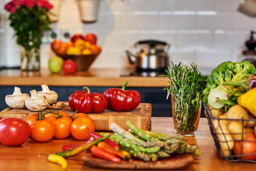Closeup on table with vegetables in kitchen.