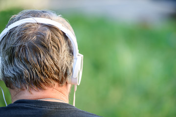 Head of a man with headphones close-up