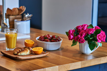 Healthy breakfast with croissant, orange juice, fresh berries. Country breakfast concept.