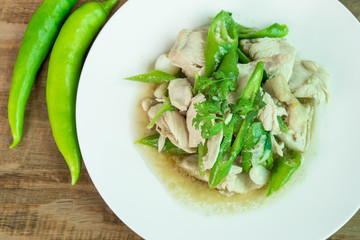 Stir Fried Chicken with green pepper on wood background, Thai food