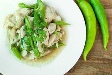 Stir Fried Chicken with green pepper on wood background, Thai food