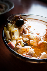 Appetizing soup Solyanka on a dark background