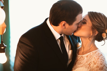 couple groom and bride in light studio