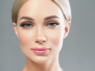 Fototapeta premium Lashes eyes blonde woman face closeup beauty healthy skin female portrait