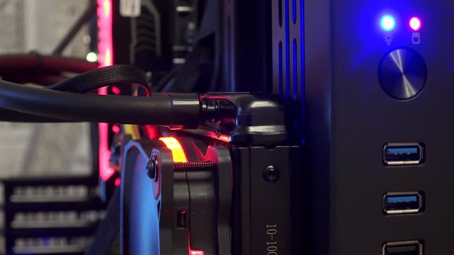 Inside the personal computer: Water cooling unit with the fan of the stylish modern PC during operation.
