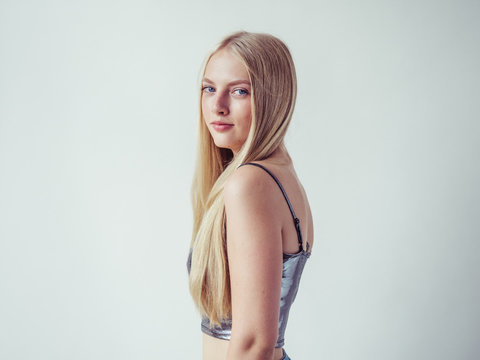 Blonde Long Hair Woman Girl In Silver Dress Over White Background