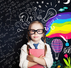 Creativity education, new ideas and right and left hemispheres of the brain concept. Smiling little girl on blackboard background with math and art pattern