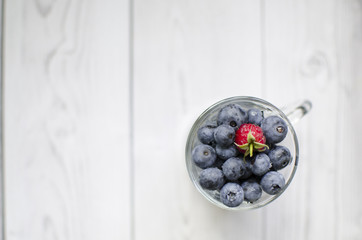 A glass of sweet blueberries
