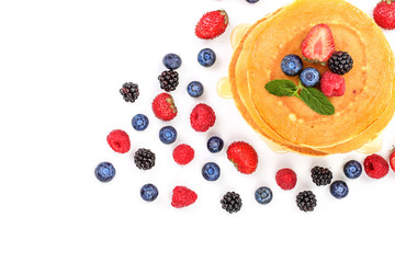 Naklejka na ściany i meble Pancakes stack with different berries isolated on white background with copy space for your text. Top view. Flat lay