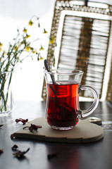 A glass of tea is on the table