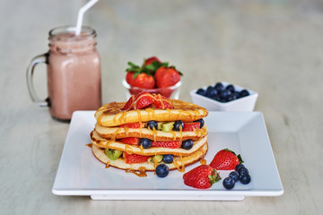 Pancake, breakfast, syrup, berries.