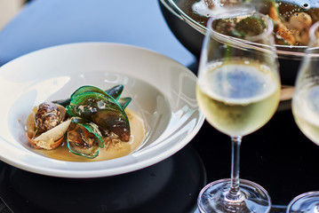 Mussels and white wine on  table