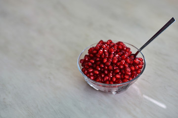 Pomegranate seeds in bowl.
