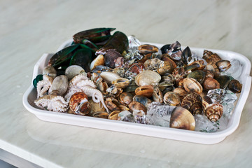 Seafood on tray ready to prepare for grill. Dinner background