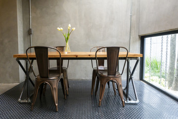 Modern desk with cement wall background