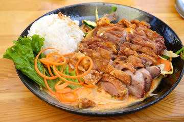 asian street food plate - roasted duck with rice and vegetables