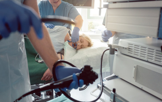 Internist doctors during stomach examination working as a team