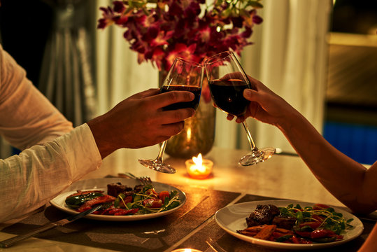 Happy couple on summer evening having romantic dinner.