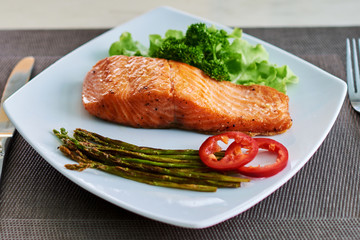 Fillet of salmon with asparagus.