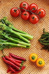 Background for food styling of  fresh  of raw vegetables and bamboo mat.