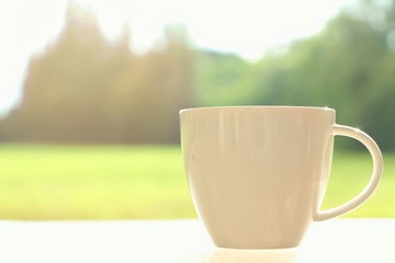 coffee cup with on nature Morning background.