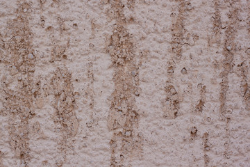 Beautiful decorative brown plastered wall. Rough texture. Brown plastered handmade rough wallpaper.