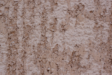 Brown plastered handmade rough wallpaper. Beautiful decorative plastered wall. Copy space for your text.