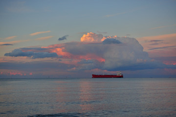 Huge tanker boat under cloud