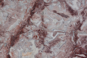 Naklejka premium Classic travertine texture. Reddish brown structure with fractures and gray spots. Used as a background.
