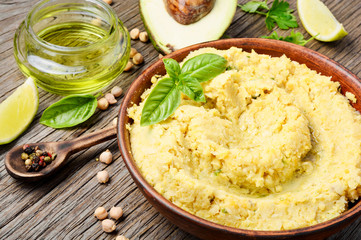 Hummus on rustic wooden table