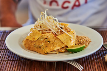 Fried noodle wrapped with eggs, Thai style food.