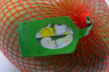 Pomelo in the package, in the grid. Instruction. How to clean pomelo, citrus.