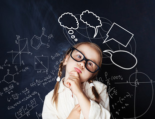 Kid brainstorm. Child mathematics student on math and science formulas background