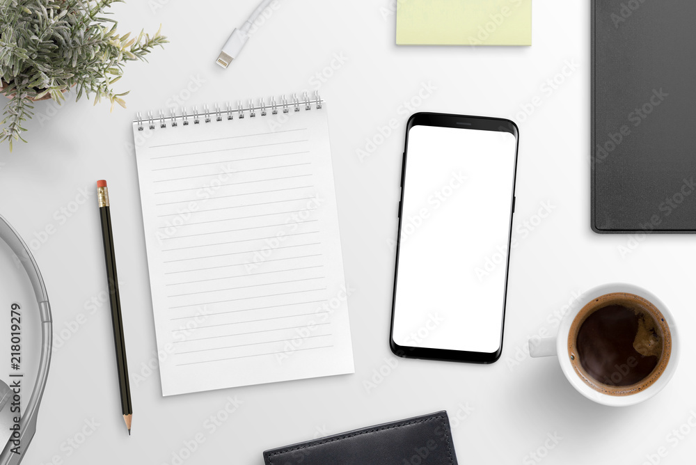 Aufkleber empty notepad and modern smart phone mockup on white office desk surrounded with office supplies. to