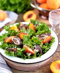Salad with fried turkey liver, peaches, parmesan, olive oil and balsamic vinegar.