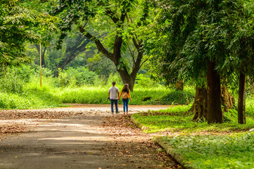 Fototapeta premium Happy married Cute couple walking in the park