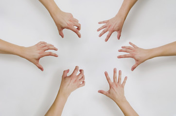 Top view on Pulling out hands for something. Attempt to grab something with hands. The concept of...