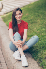 Straight-haired young beautiful smiling brunette girl wearing ca