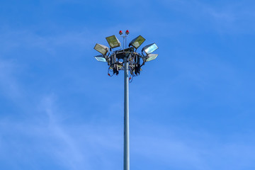 High mast lighting in airport on blue sky background.