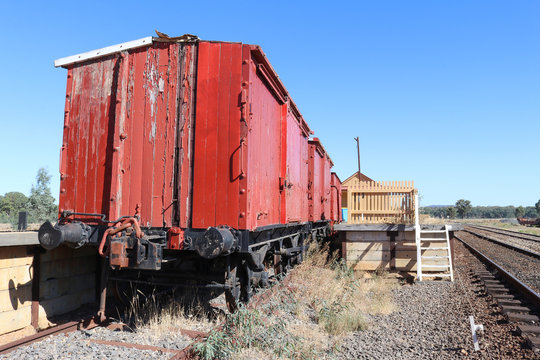 old red painted wooden train carriages at the Muckleford railway station
