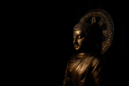 Buddha portrait isolated on black