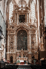 The interior of the old church in Krakow. Icons in the church. Ancient architecture. Gothic church in Poland.