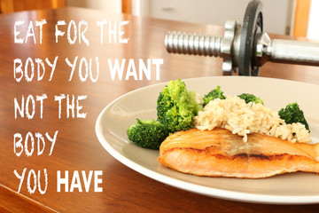 inspirational healthy eating quote on food and dumbbell background