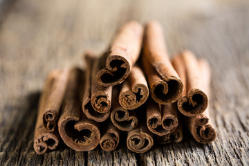 cinnamon sticks on a wooden background close-up