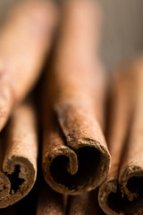 cinnamon sticks on a wooden background close-up