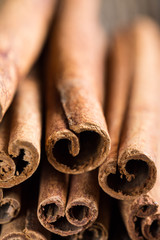 cinnamon sticks on a wooden background close-up