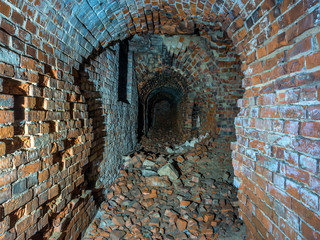 Kaliningrad, Russia - May, 2018. Ruined brick underground tunnel or corridor.