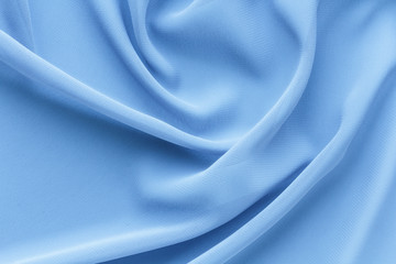 light blue fabric with large folds, delicate background