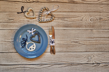 Fototapeta na wymiar Festive table setting for Christmas on rustic wooden background. Top view with copy space.